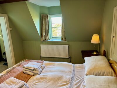 One bed flat, furnished, kitchen, living room with sofabed & woodburner, parking with EV Charger