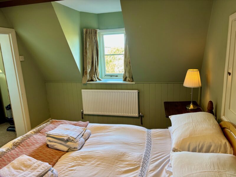 One bed flat, furnished, kitchen, living room with sofabed & woodburner, parking with EV Charger