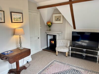 One bed flat, furnished, kitchen, living room with sofabed & woodburner, parking with EV Charger