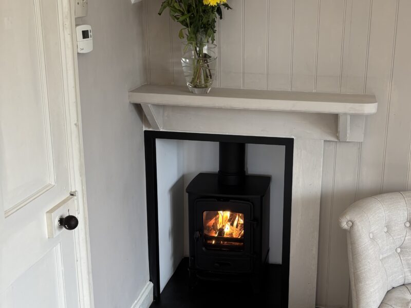 One bed flat, furnished, kitchen, living room with sofabed & woodburner, parking with EV Charger