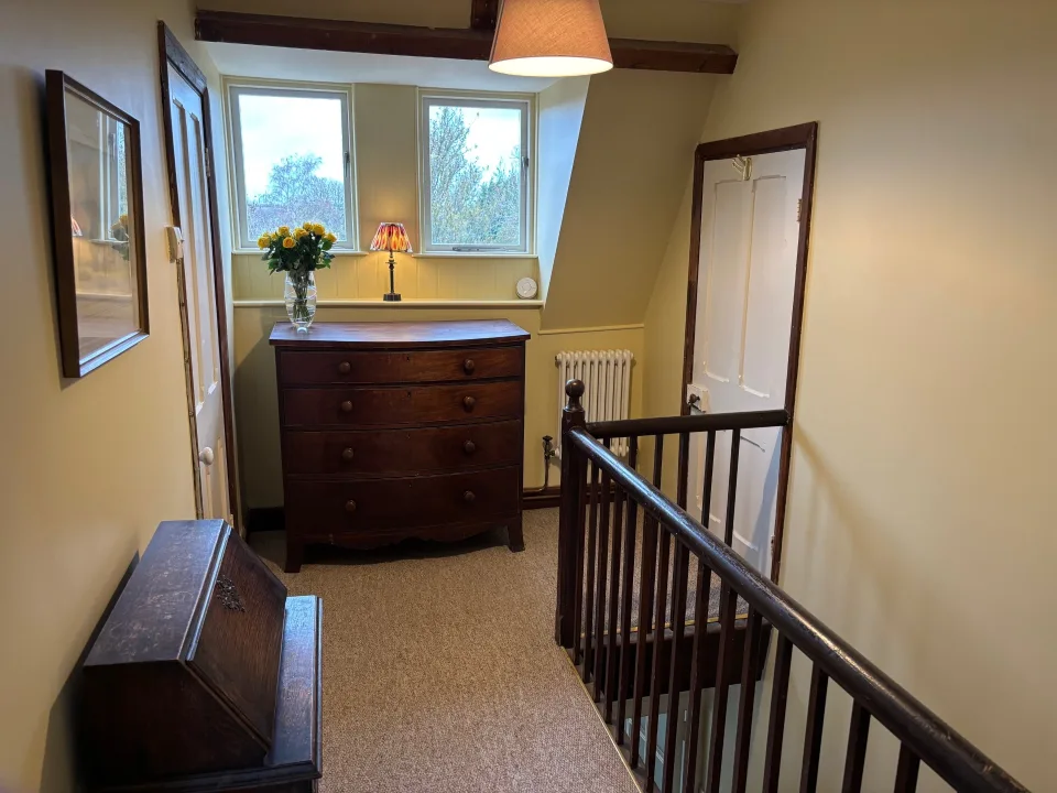 One bed flat, furnished, kitchen, living room with sofabed, woodburner, parking with EV Charger